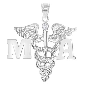 May include: Silver medical pendant necklace with a caduceus symbol and the letters "MA" on either side.