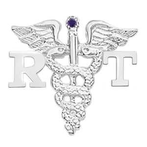 May include: Silver-toned medical caduceus pin with a purple gemstone, surrounded by wings, and the letters "RT" on the right and "R" on the left.