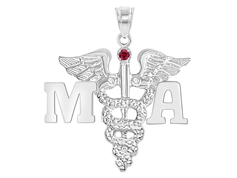 May include: Silver medical pendant necklace with a red gemstone and the letters "MA" on either side of the caduceus symbol.