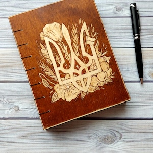 Ukrainian symbol, notepad for a man in a wooden cover Ukraine, wooden book for records with an engraving handmade Ukrainian symbol