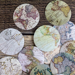 May include: A collection of vintage world map coasters, featuring various continents and oceans. The coasters are circular and have a distressed, antique look.