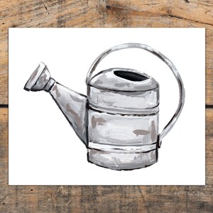 May include: A white painted metal watering can with a black handle and spout. The can has a rustic, vintage look.