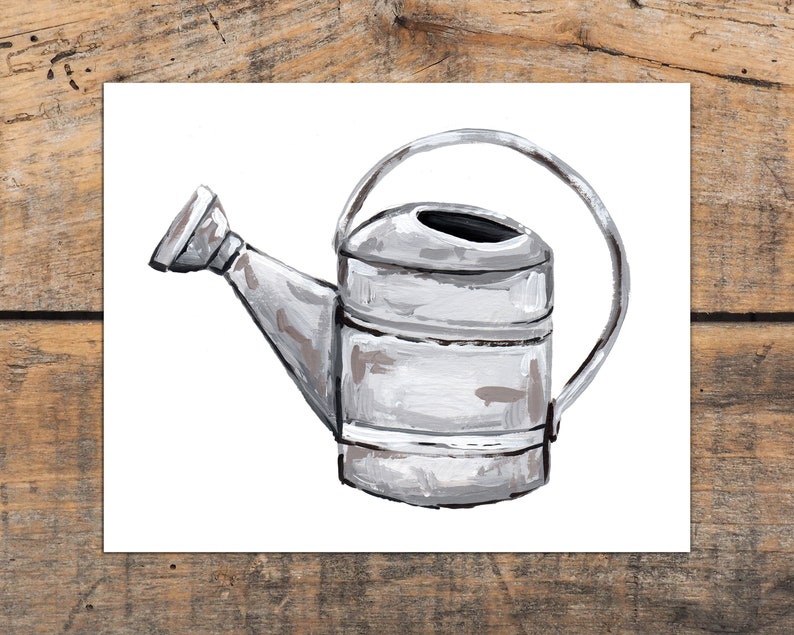 May include: A white painted metal watering can with a black handle and spout. The can has a rustic, vintage look.