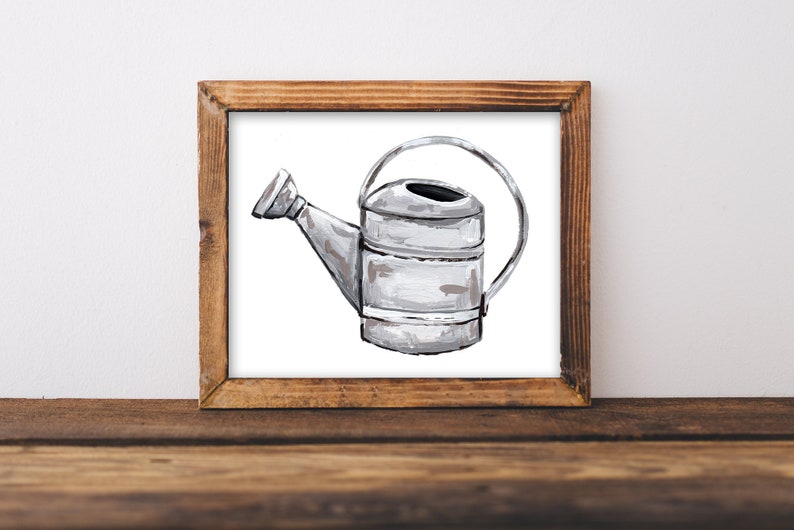May include: A silver watering can with a handle, painted in a white and gray watercolor style. The watering can is framed in a rustic wooden frame.