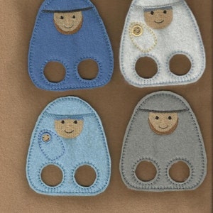 May include: Four felt finger puppets depicting the nativity scene. The puppets are blue, white, light blue, and gray. Each puppet has a face with embroidered features and a simple design.