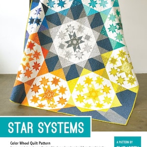 Pode incluir: Um padrão de colcha intitulado "Star Systems" de Elizabeth Hartman. A colcha apresenta um design de roda de cores com uma série de "Star Systems" monocromáticos dispostos em uma composição de roda de cores impressionante.