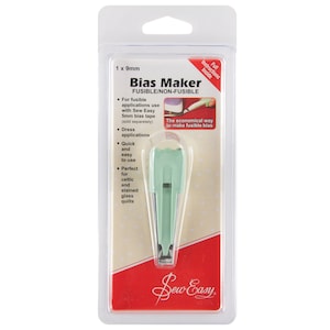 May include: A green bias maker tool for creating fusible or non-fusible bias tape. The tool is 9mm wide and is packaged in a red and white plastic package with the text "Bias Maker" and "Sew Easy".