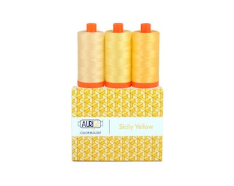 May include: Three spools of Aurifil thread in the color "Sicily Yellow" with a yellow and white geometric pattern on the box.