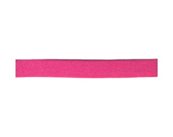 May include: A pink elastic band, approximately 1 inch wide.