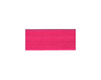 May include: A vibrant fuchsia-colored headband. The headband is made of a soft, stretchy material. This accessory is designed to keep hair out of the face during workouts or to add a pop of color to any outfit.
