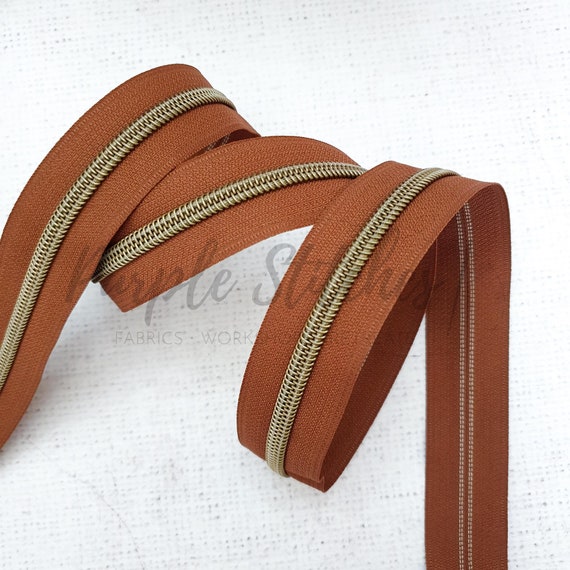 #5 Nylon Coil Zipper Brown/Gunmetal - PER QUARTER METRE #5 Nylon Coil Zipper Brown/Gunmetal - PER QUARTER METRE