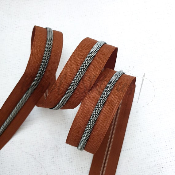 #5 Nylon Coil Zipper Brown/Gunmetal - PER QUARTER METRE #5 Nylon Coil Zipper Brown/Gunmetal - PER QUARTER METRE