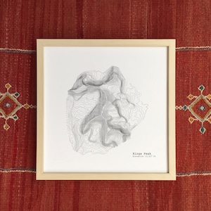 May include: A set of three ceramic mugs with a speckled, matte finish. Each mug features a different color: light blue, cream, and gray. The mugs have a simple, modern design and a comfortable handle.