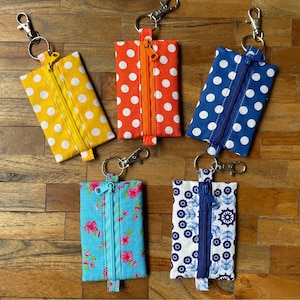 Small Zippered Pouch for small items like Earbuds, coins, personal cards, keys etc. Made from colourfull cotton and easy to fix.