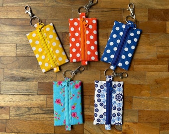 Small Zippered Pouch for small items like Earbuds, coins, personal cards, keys etc. Made from colourfull cotton and easy to fix.