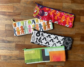 Small cotton pencil case, colorful, in various patterns like flowers, retro, children and moustaches.