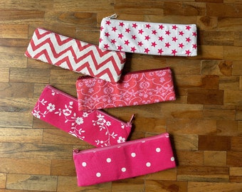 Small cotton pencil case, pink, in various patterns like flowers, chevron, ornaments, polka dot and stars.