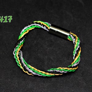 Woven bracelet in gray, black, green and mustard nylon thread