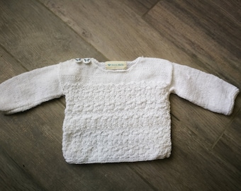 Knitted openwork white sweater for doll