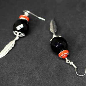 Black faceted sphere earrings