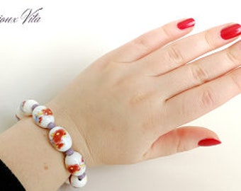 Bracelet en perles céramiques avec des motifs