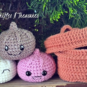 May include: Crocheted onion-shaped toys in white, pink, and tan, each with embroidered faces. A crocheted basket with a lid is also present. The text "Trifles N Treasures" is visible in the upper left corner.