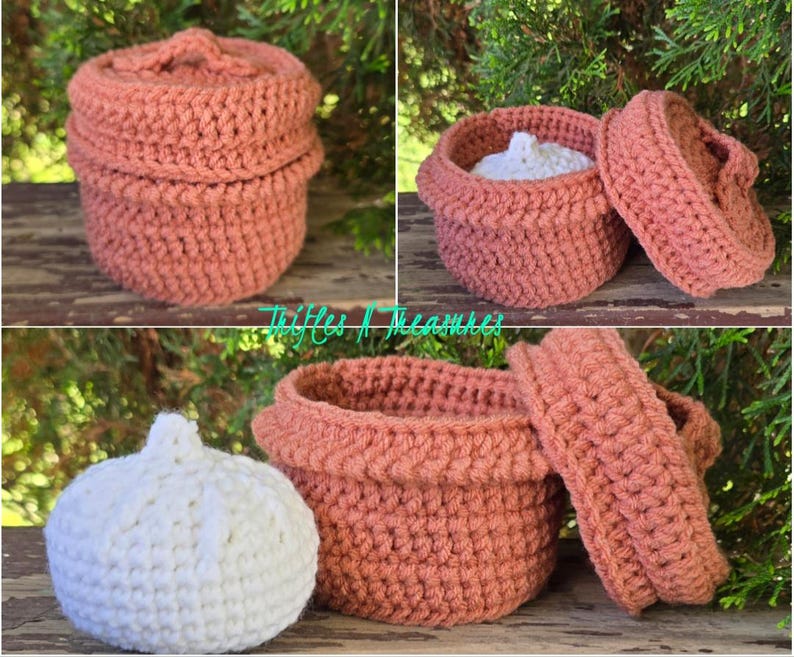 May include: A set of three crochet baskets in a warm terracotta color. One basket is closed with a matching lid, another is open with a white crochet ball inside, and the third is open with the lid beside it. The baskets are handmade.