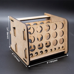 Puede incluir: Organizador de madera con 36 agujeros redondos para guardar objetos pequeños, que mide 8,6 cm de alto y 10,1 cm de ancho.