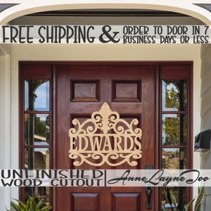 May include: Unfinished wooden cutout of the name "Edwards" in a decorative, ornate font. The cutout is mounted on a brown wooden door with a glass panel. The text "FREE SHIPPING & ORDER TO DOOR IN 7 BUSINESS DAYS OR LESS" is visible above the door.