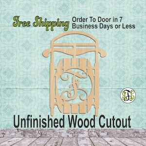 May include: Unfinished wooden cutout of a sled with a monogrammed circle in the center. The monogram is the letter "F".