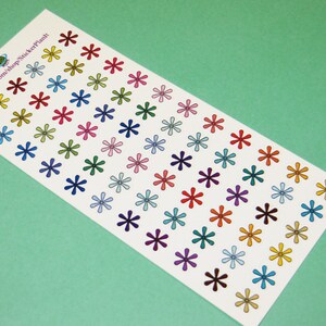 May include: A sheet of colorful star-shaped stickers. The stickers are arranged in rows and columns on a white background. The text "www.etsy.com/shop/StickerPlanit" is printed in the top left corner.
