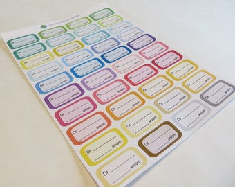 May include: A sheet of colorful rectangular stickers with the text "Dr. ____ am/pm" printed on each sticker. The stickers are in various colors, including green, blue, yellow, orange, pink, and purple.