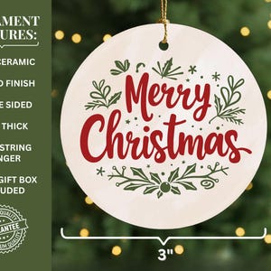 May include: A round, ceramic Christmas ornament, 3 inches in diameter, with a glazed finish. The ornament features the words "Merry Christmas" in red script, surrounded by green botanical illustrations. It includes a gold string hanger.