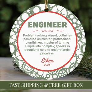 May include: A round, white Engineer ornament with a red border and green gear design. The ornament features the name "Ethan" and the year "2025". The text describes an engineer's skills and personality.