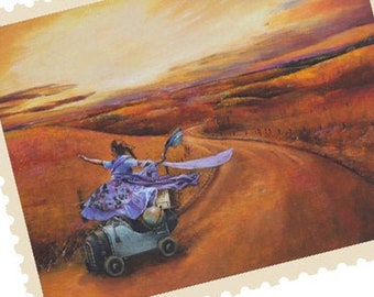 May include: A woman in a purple dress rides a vintage toy car down a dirt road. The road leads to a distant sunset over a field of golden grass.