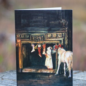 May include: A white horse with a red bow stands in front of a fireplace with stockings hanging from the mantle. The stockings are filled with toys and gifts. A person in a white dress is standing next to the horse, looking at the stockings.