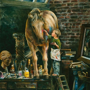 May include: A young artist paints a brown horse with a paintbrush in a studio setting. The horse is standing on a wooden table with various art supplies, including paint tubes, brushes, and jars. The artist is wearing a green shirt and a white apron.
