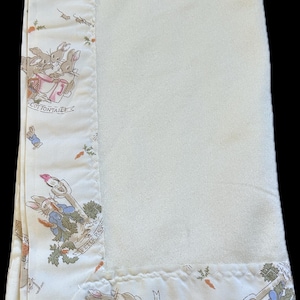 May include: A set of three ceramic mugs with a speckled, matte finish. The mugs are in shades of cream, light gray, and dark gray. Each mug has a simple, minimalist design, perfect for coffee or tea.