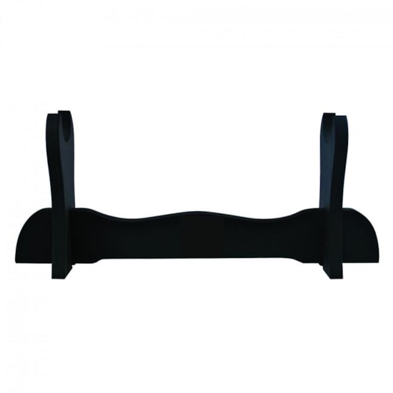 May include: Black wooden sword stand with two curved arms for holding a katana or other sword.