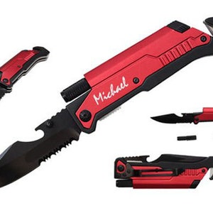 May include: A red and black multi-tool knife with a serrated blade, bottle opener, and a safety glass breaker. The knife has a personalized inscription that reads "Michael".