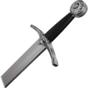 May include: A silver and black sword with a rounded pommel and a cross guard. The blade is straight and double-edged.
