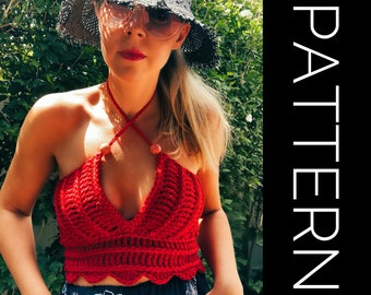 May include: A red crochet halter top with a scalloped hem and beaded ties. The top is worn by a person with blonde hair and a black sun hat.