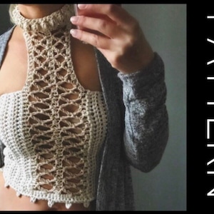 May include: A cream-colored crochet top with a high neck and openwork design. The top is paired with a gray cardigan. The word "PATTERN" is displayed vertically in white text on a black background.