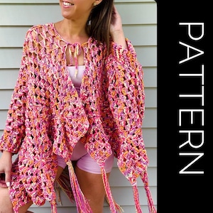 May include: A crochet cardigan featuring a variegated yarn pattern in shades of pink, orange, and yellow. The garment has an open-front design with a tie closure at the neckline, long sleeves, and long fringe tassels at the hem. The word PATTERN is visible.