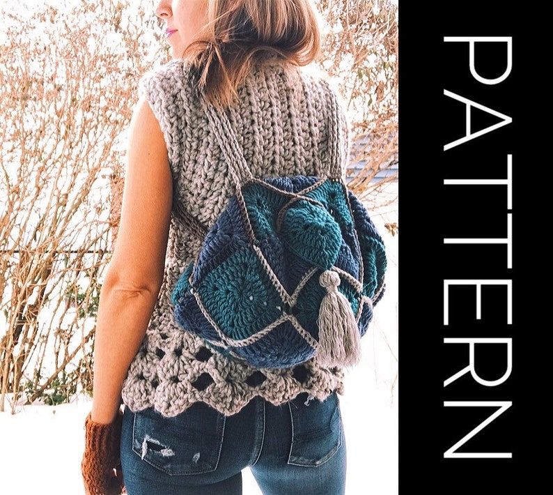 May include: A crocheted backpack with a blue, green and brown colour scheme. The backpack has a tassel hanging from the bottom.