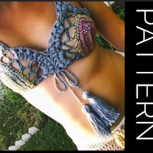 May include: A crocheted bikini top with a multicolored pattern and blue tassels. The top is made with a delicate, open-stitch design.