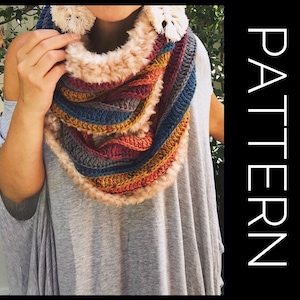 Peut inclure: Une écharpe en crochet infinie colorée avec une doublure en fausse fourrure. L'écharpe est faite avec une variété de couleurs, y compris le rouge, l'orange, le jaune, le bleu et le gris. L'écharpe est portée par une personne.