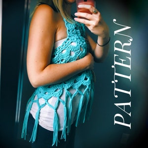 May include: A turquoise crochet vest with fringe detailing. The vest is worn over a white tank top and blue jeans.