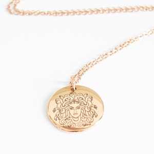 Gold Medusa necklace with round stainless steel pendant on fine chain