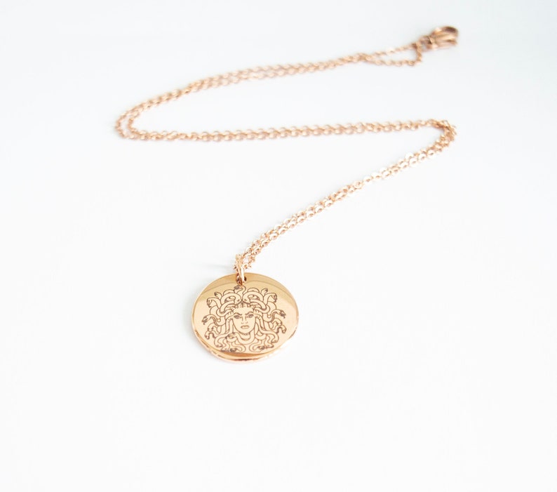 Gold Medusa necklace with round stainless steel pendant on fine chain